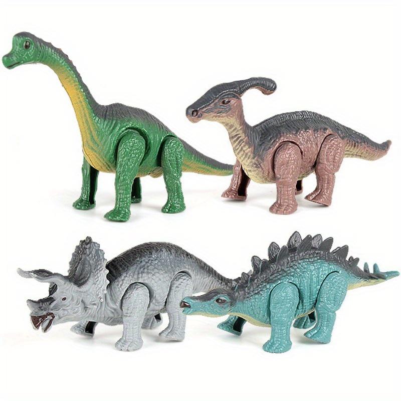 The Boy Received a Set of Dinosaur Toy Gifts, Including a Wind-up Mechanical Animal Toy with Automatic Walking. This Is a Birthday Gift for Children. Christmas, Halloween Gift