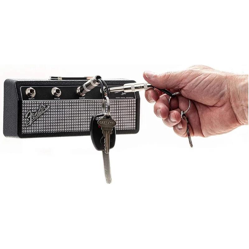 Licensed Fender Jack Rack- guitar amp key holder, includes 4 guitar plug keychains and 1 wall mounting kit. Quick and easy installation.